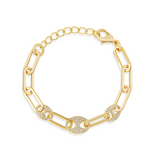 Gold chain bracelet with interlocking links on a white background